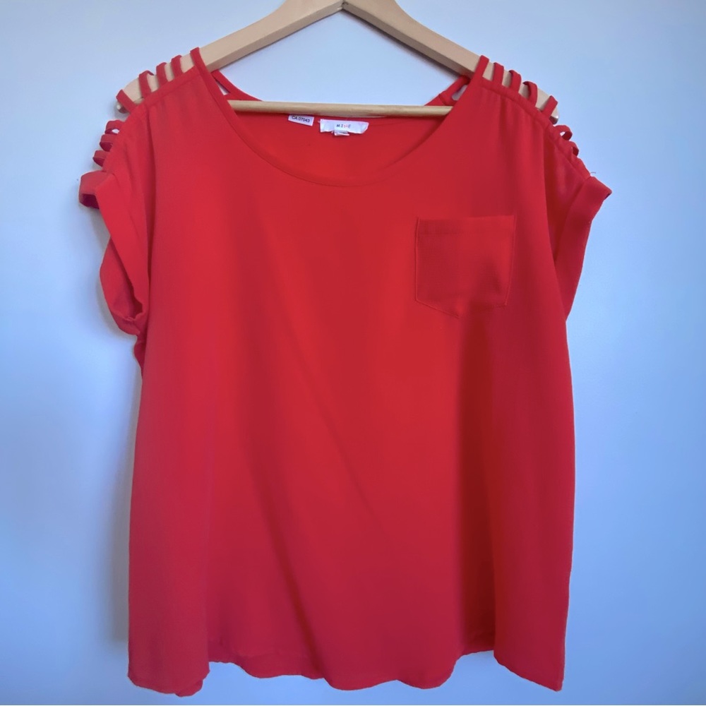 Mine. Orange-red top. Medium. Shoulder cut-out detail. Loose fit.